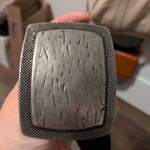 Textured Silver Belt Buckle With Black Belt